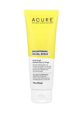 Acure Brightening Facial Scrub in yellow packaging, designed for radiant skin and gentle exfoliation